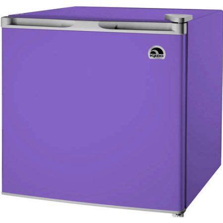 a purple refrigerator freezer sitting on top of a counter