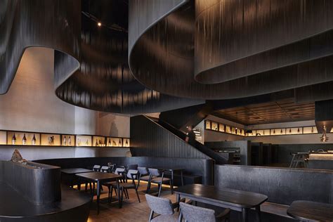 Free flow dark screens are suspended from ceiling of restaurant ...