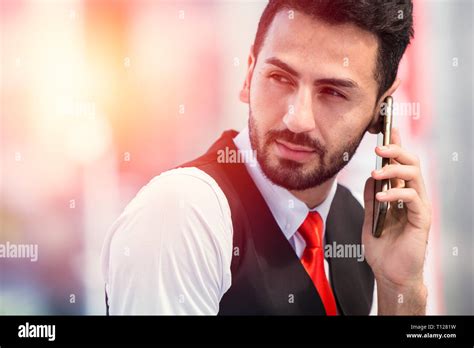 Hipster businessman making phone call waiting for business contact Stock Photo - Alamy