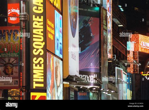 times square signs new york city night Stock Photo - Alamy