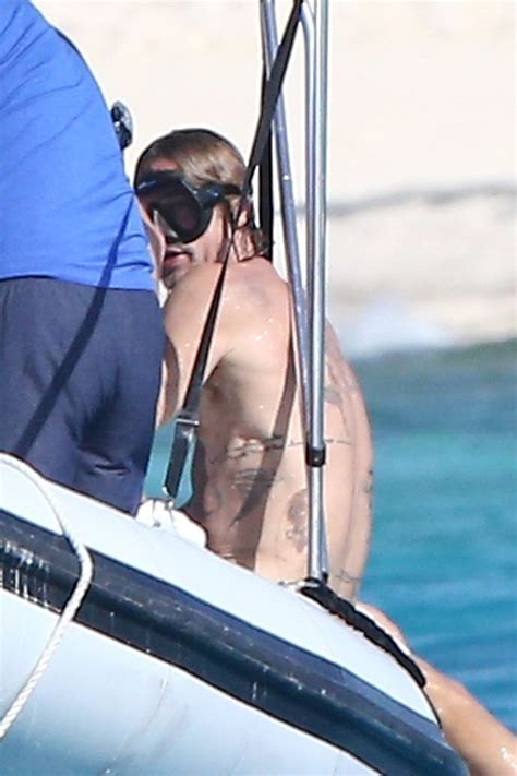 Brad Pitt Shows Off His Tattoo Collection While Snorkeling on Turks ...