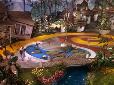 Munchkinland scene from The Wizard of Oz (1939 film), art direction by Cedric Gibbons. | Design ...