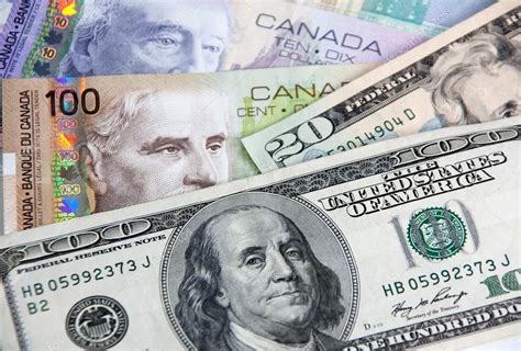 Canadian dollars vs. US dollars — Stock Photo © yulan #16811249