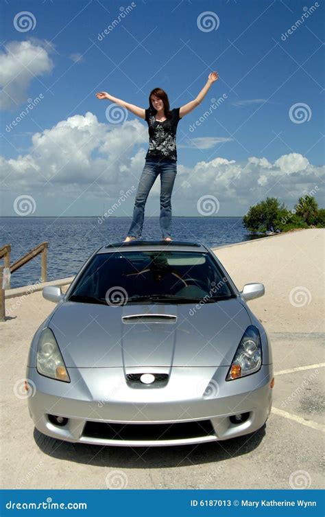 Happy Woman Standing on Roof of Car Stock Image - Image of journey, happiness: 6187013