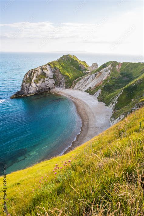 Man of War Beach on West Lulworth Cove and Durdle Door at Sunset. Stock Photo | Adobe Stock