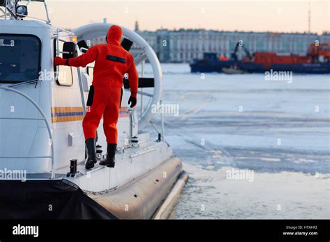 Worker of coast guard team on rescue boat Stock Photo - Alamy