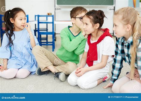 Children Playing Telephone Game Stock Image - Image of school, primary: 117730171