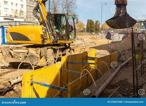 Excavator Filling Deep Excavation Supported By Trench Box With Pipe ...