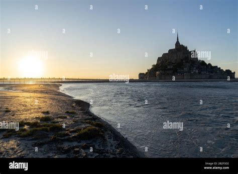 Sunset at Mont Saint Michel as the tide comes in, Normandy, France ...