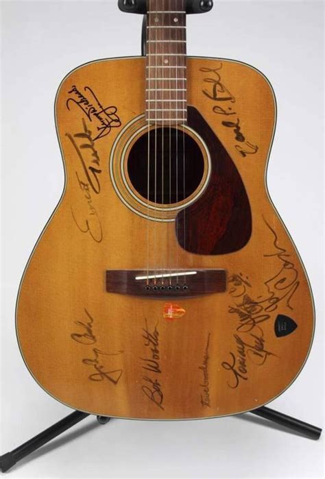 JOHNNY CASH AND OTHERS SIGNED GUITAR