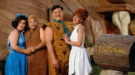 In The Flintstones (1994), Fred and Barney are portrayed living middle class lifestyles while ...