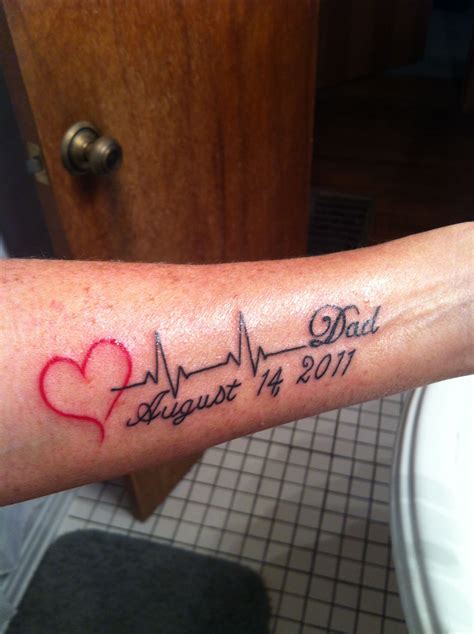 a person with a heart and heartbeat tattoo on their arm