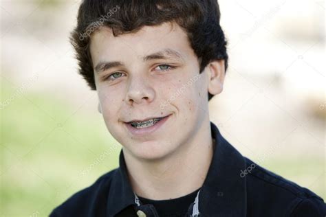 Smiling teenage boy with braces Stock Photo by ©jbryson 21366867