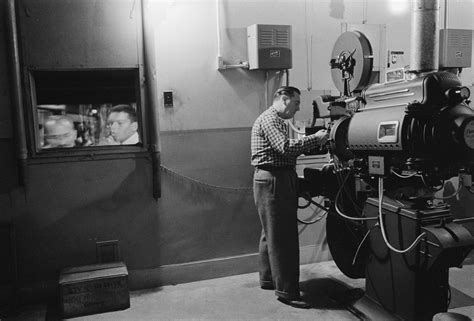 File:Man working with a projector in a movie theater 1958.jpg