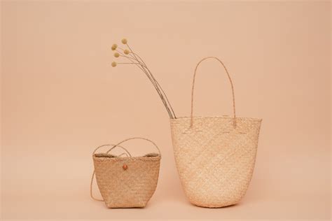 2 Brown Wicker Baskets on White Table · Free Stock Photo