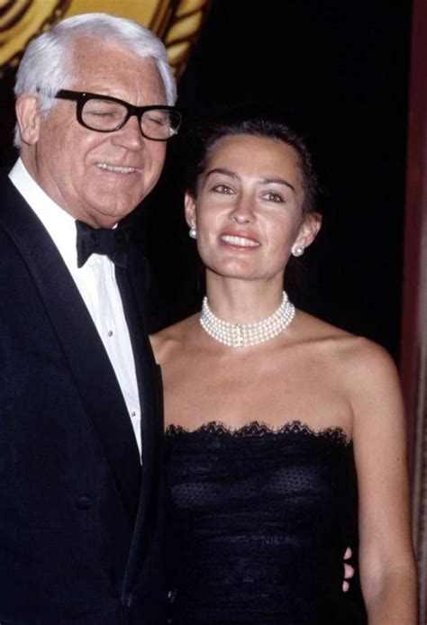 an older man and young woman in formal wear