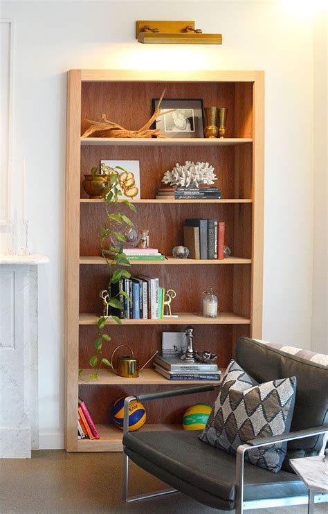 Bookshelf Design Ideas – Wood-Lined, Built-In Bookshelves Provide Extra Storage Space In This ...