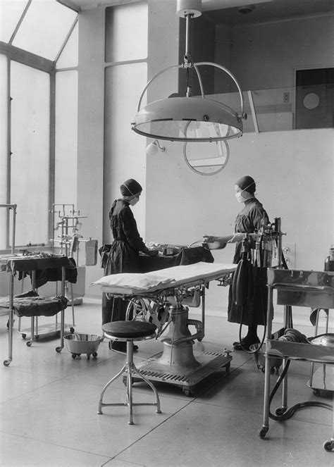 Two theatre nurses in an operating theatre at Barts Hospital, London. | Theatre nurse, Nurse ...