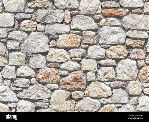 Block stone wall made from irregular sized stone blocks Stock Photo - Alamy