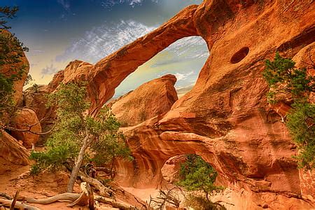 Royalty-Free photo: Body of water near rock formations | PickPik