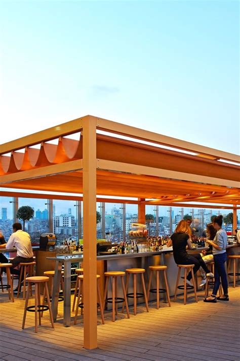 The rooftop bar has been kitted out by Starck in a rainbow of neon chairs and plant pots. # ...