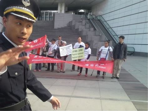 GRAIN | Photo essay: Demonstrators in Beijing protest acquisition of Syngenta in front of ...