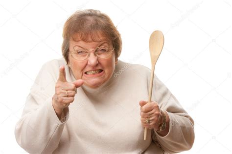 Upset Senior Woman with The Wooden Spoon Isolate Stock Photo by ©Feverpitch 2354684