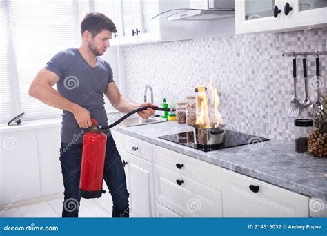 Man Extinguishing Burning Cooking Pot Stock Photo - Image of people ...