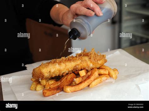 Putting vinegar on fish and chips Stock Photo, Royalty Free Image: 27522911 - Alamy