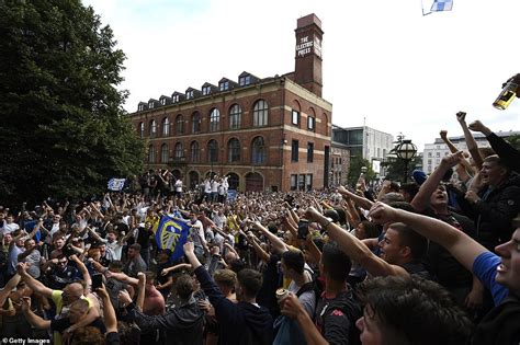 Leeds United fans celebrate Premier League promotion at non-socially distant street party ...