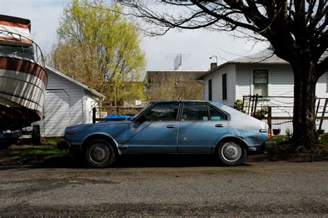 OLD PARKED CARS.: 1981 Datsun 310 GX 5 Door Hatchback.