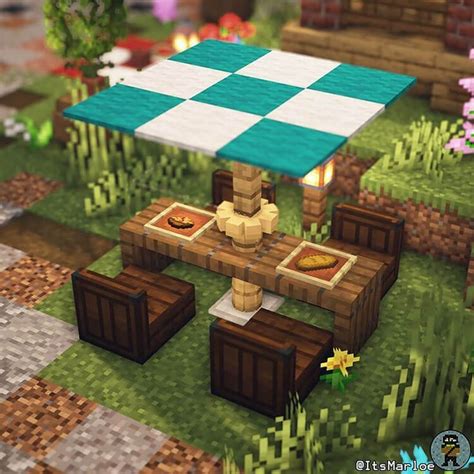 a picnic table in the middle of a garden