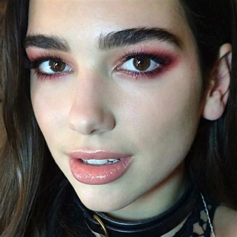 Dua Lipa Makeup: Black Eyeshadow, Red Eyeshadow & Pink Lip Gloss | Steal Her Style