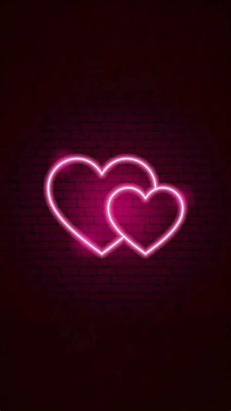 Download Two Pink Neon Hearts With Brick Wall Wallpaper | Wallpapers.com