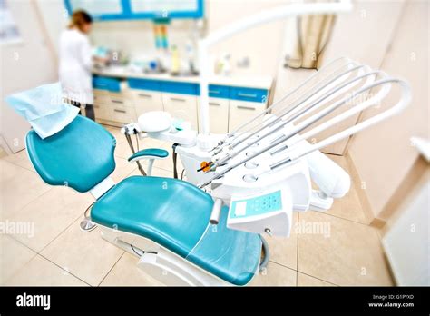 Professional Dentist tools and chair in the dental office. Dental Hygiene and Health conceptual ...