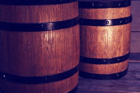Premium Photo | Two old wooden wine barrels closeup