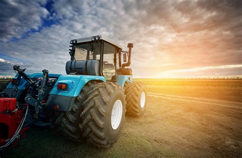 Tractor Working On The Farm, A Modern Agricultural Transport, A ...