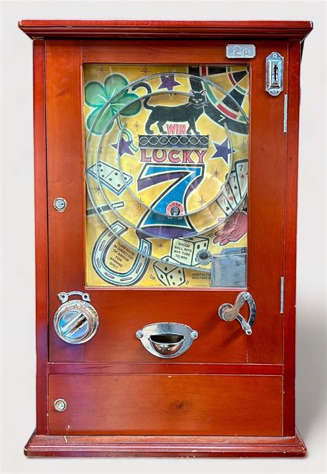 A 2p coin operated ‘Lucky 7’ pinball type amusement arcade machine, in ...