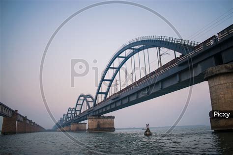 Image of Godavari Arch Bridge and A Fisherman-KE768380-Picxy