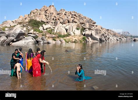 Women bathing in tungabhadra river hi-res stock photography and images ...