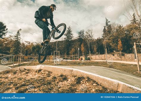 BMX Rider Making Tricks .Guy Riding a Bmx Bike Stock Photo - Image of ...