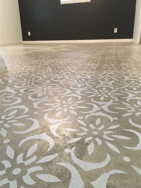 My new stenciled concrete floors. Out with the carpet!