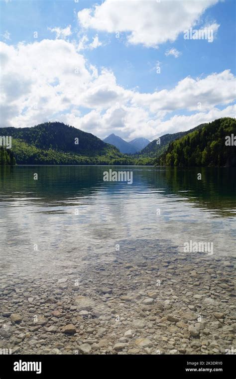 gorgeous emerald-green lake Alpsee in the German Alps in Hohenschwangau near castles ...