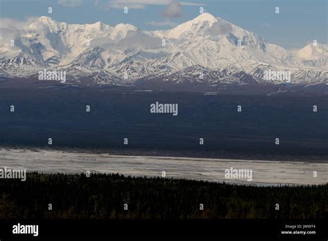 Mountains with snow along the Alaska highway near Delta Junction ...