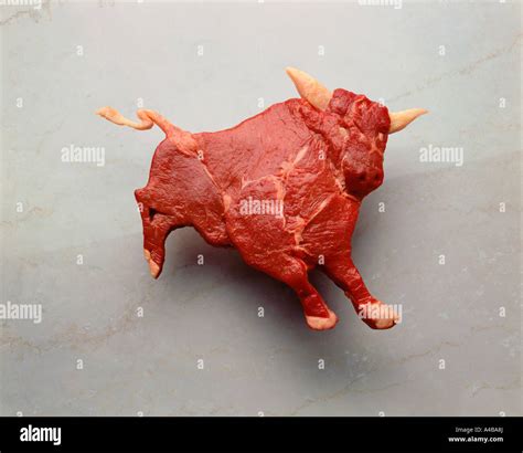 Raw meat beef shaped liked a bull Stock Photo - Alamy