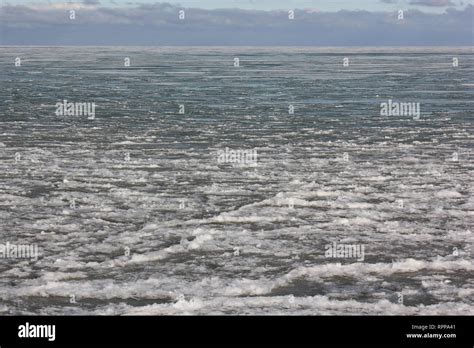 The frozen shoreline of Lake Michigan on a sunny winter day Stock Photo ...