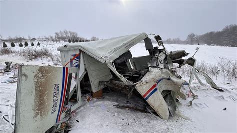 Postal truck driver seriously injured in head-on crash