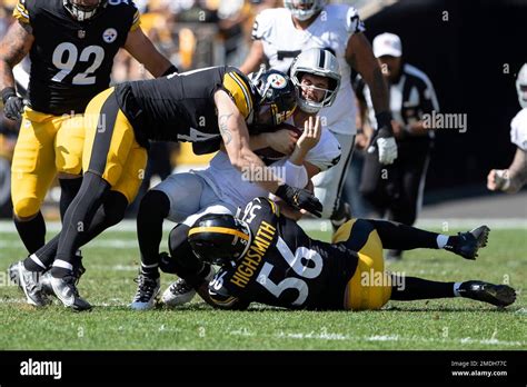 Las Vegas Raiders quarterback Derek Carr (4) is tackled during an NFL football game, Sunday ...