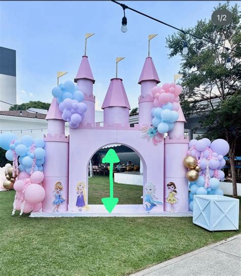 an inflatable castle with balloons and princess figures