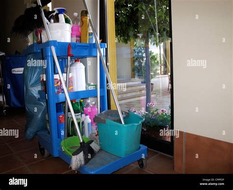 Hotel cleaning cart placed in front of guest room Stock Photo - Alamy